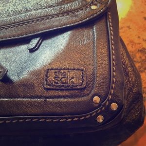 The sak. Black Crossbody/ backpack